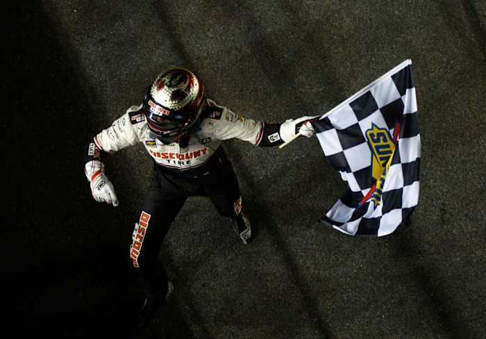 Austin Cindric makes it official, taking the checkered flag after winning the 64th Daytona 500 on Sunday. (Photo by Sean Gardner/Getty Images)